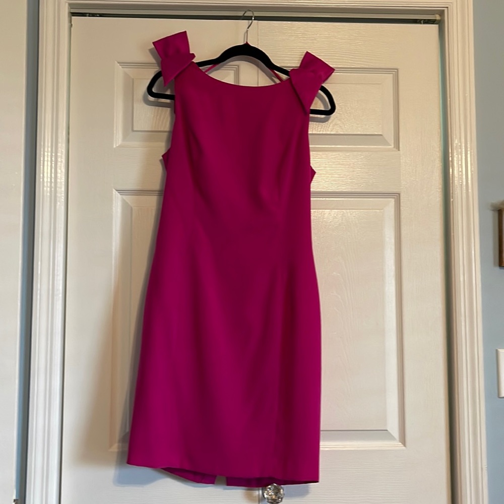 Adorable cocktail dress with low cut back and bows
